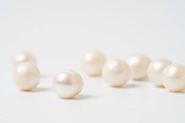 istock pearl necklace isolated on white background 1199015023