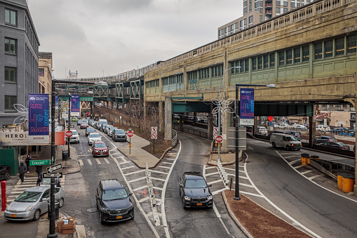 Queensboro Station, Long Island City, Queens, New York, USA, December 4, 2019: Overground subway station and traffic