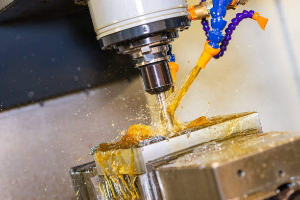 istock The mold and die manufacturing process with machining center by oil coolant method. 1199018730