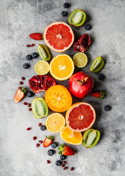 istock Multicolored seasonal healthy natural fruit composition with persimmon, blueberries, orange, kiwi, strawberries, grapefruit, pomegranate, orange slices. 1199020028