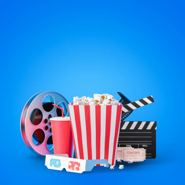 istock Popcorn, clapper and film reel on blue, mock up 1199020269