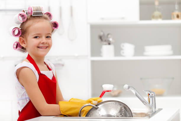 istock Little houskeeping girl 1199020491