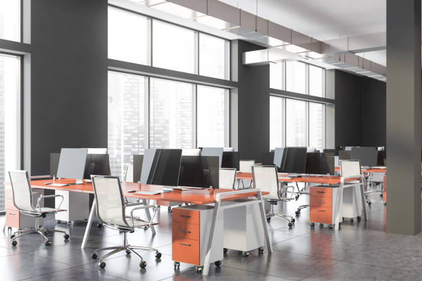 istock Gray industrial style office corner, orange tables 1199020548