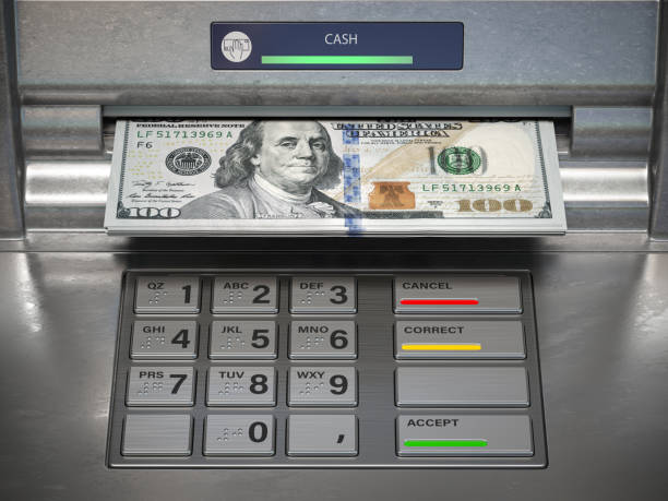 istock Wthdrawing dmonet from ATM machine. Dollar banknotes in cashpoint. 1199021341