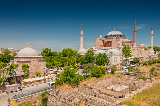 Architectural detail from Hagia Sophia or Ayasofya Mosque over sunny blue sky in Istanbul, Turkey