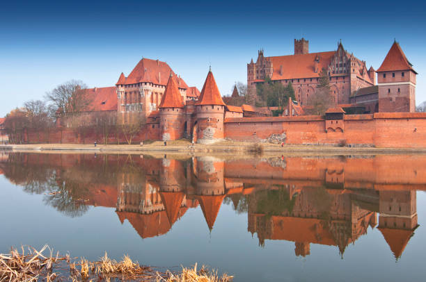 Malbork Castle and reflection in River Nogat, Poland. Malbork Castle and reflection in River Nogat, Poland. marienburg stock pictures, royalty-free photos & images