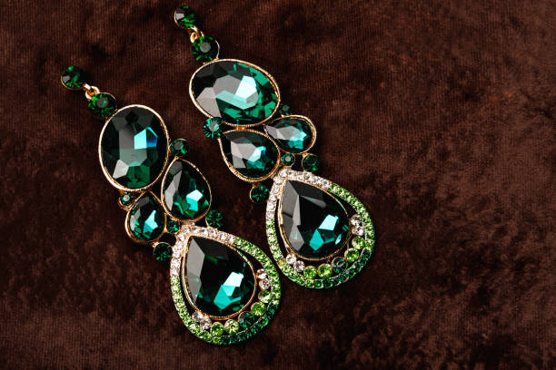 istock Luxury earrings with green gemstones 1199024472