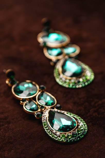 istock Luxury earrings with green gemstones 1199024521