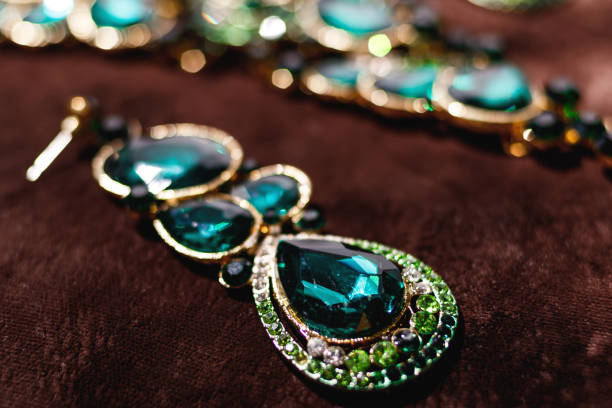istock Luxury earrings with green gemstones 1199024558