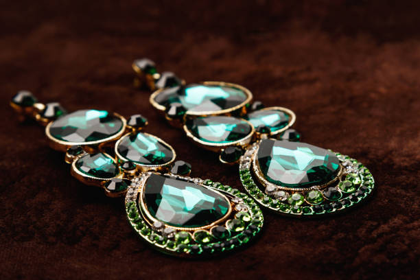 istock Luxury earrings with green gemstones 1199024582