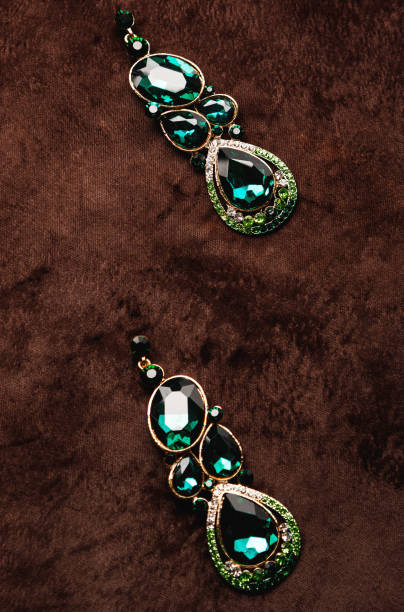 istock Luxury earrings with green gemstones 1199024617