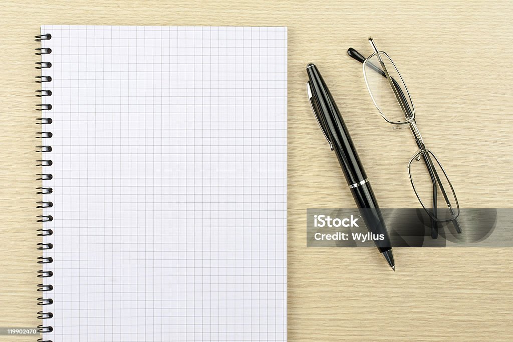 Notebook, glasses and pen  Black Color Stock Photo
