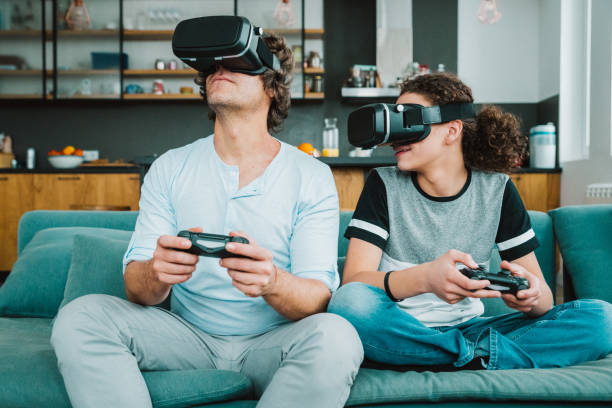 istock Father and son playing with VR 1199026102