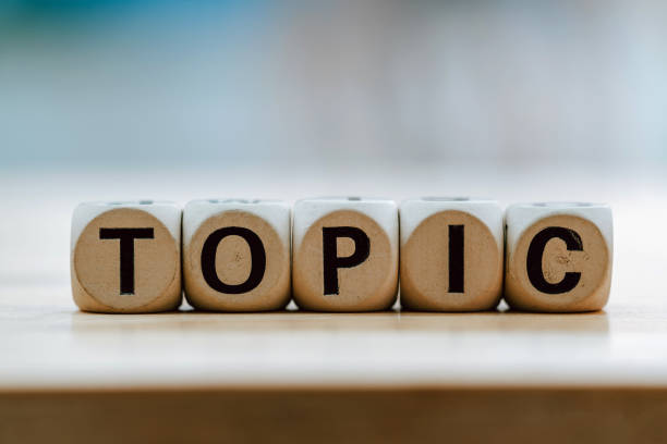 istock TOPIC concept with wooden block on wooden table background. 1199027649