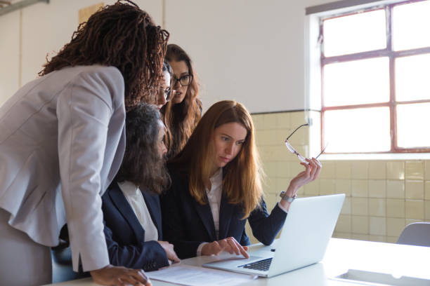 istock Serious businesswomen working with laptop computer 1199031719