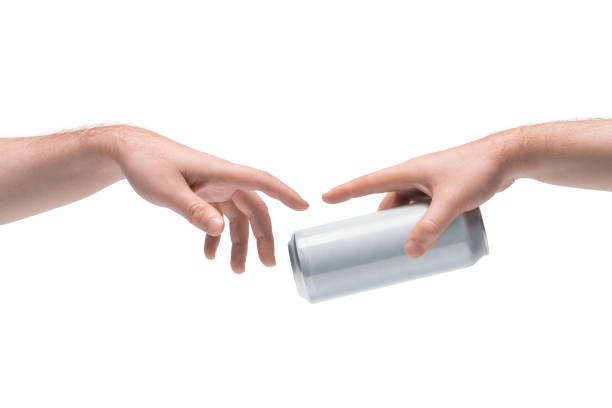 Two male hands passing one another blank white beer can on white background Isolated man's hands passing an item. Interaction between two people metaphoral stock pictures, royalty-free photos & images