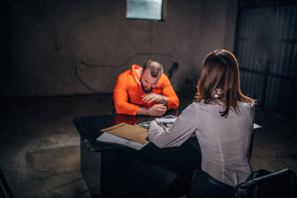 istock Prisoner and female detective 1199038342