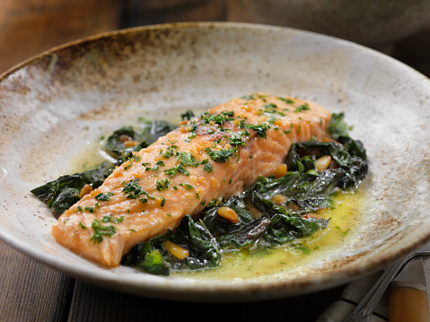 Lemon, Garlic and Butter Poached Salmon with Swiss Chard and Toasted Pine nuts