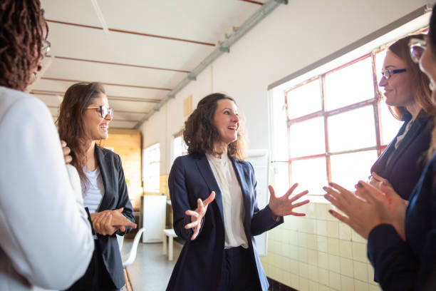 istock Excited mature employee talking with colleagues 1199039846