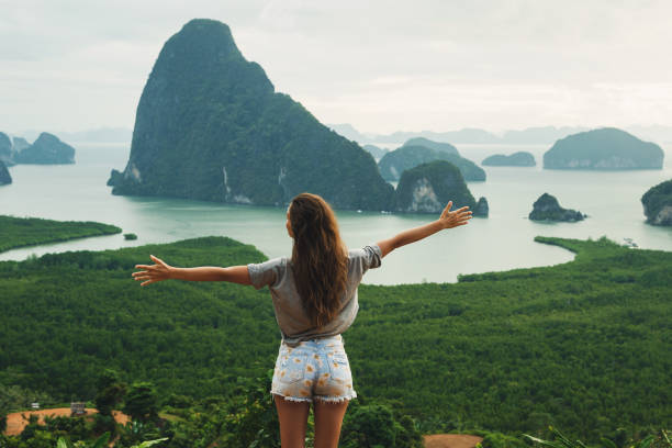 istock Young woman looking at the beautiful landscape 1199040855