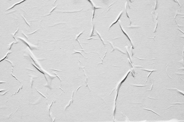 istock Crumpled white paper. Abstract background for the designer. 1199041116