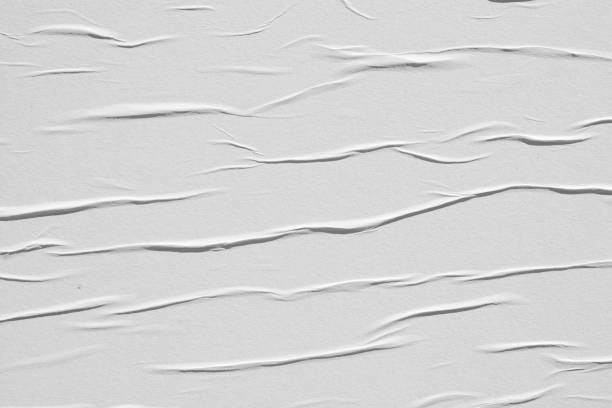 istock Crumpled white paper. Abstract background for the designer. 1199041127