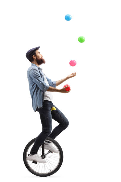 istock Man riding a unicycle and juggling with balls 1199042301