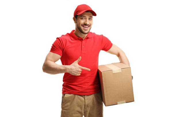 istock Delivery guy holding and pointing to a box 1199042422