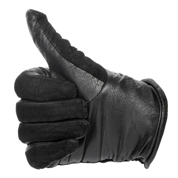 istock hand in a black leather glove with thumb up. 1199042423