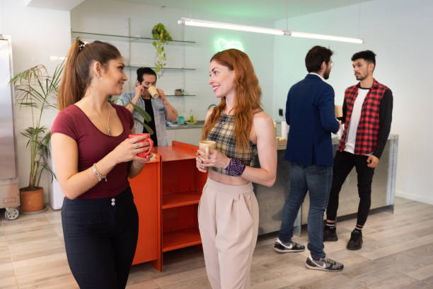istock Coffee break in co-working business team 1199044342