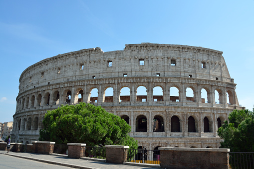 ROME / ITALY - AUGUST 2018: Interior images of the ruins of The Colosseum filled with visiting tourists. Built in 70-80 AD the Colosseum remains one of the most popular tourist attractions in Italy.