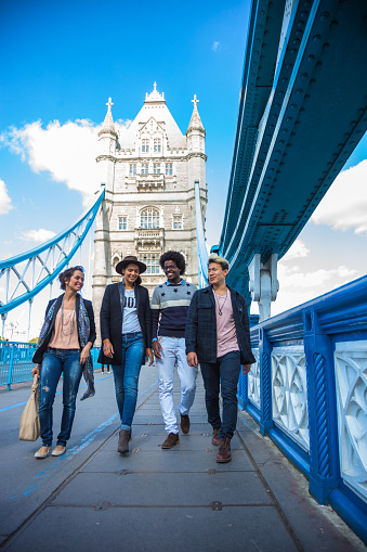 Multi cultural group of friends hanging out in Central London, on the Tower Bridge.