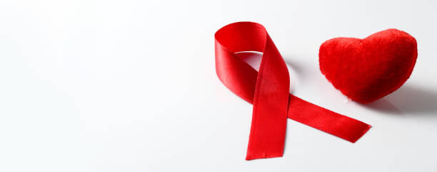 istock Aids ribbon and heart on white background. 1199046582