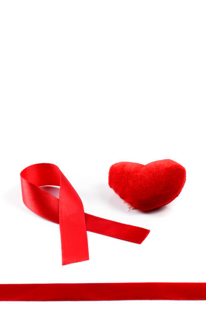 istock Aids ribbon and heart on white background. 1199046675