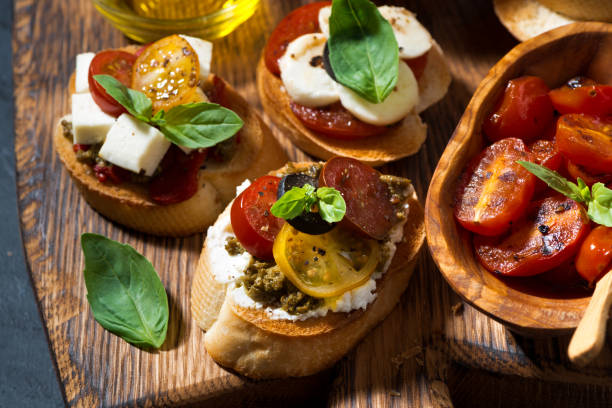 istock Italian appetizers - various bruschettas, top view 1199047348