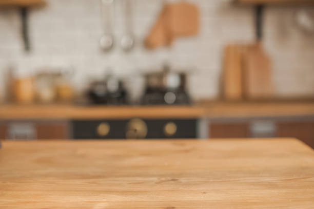 istock Christmas kitchen decor and copy space. Rustic kitchen in defocus. Wooden table in focus. 1199047377