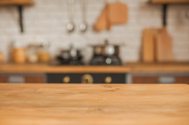 istock Christmas kitchen decor and copy space. Rustic kitchen in defocus. Wooden table in focus. 1199047386