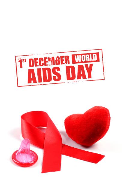 istock Aids ribbon, condom and heart on white background. 1199047737