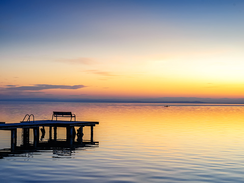 Jetty on lake neusiedlersee in burgenland at sunset