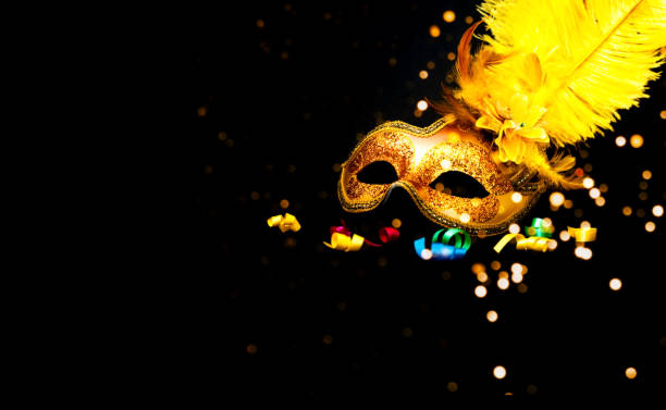 istock Carnival mask on black background with sparkles. Mardi gras concept. Copy space 1199048578