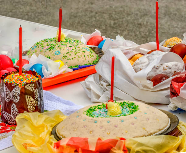 istock Easter eggs and cakes on lighting near the temple. 1199048608