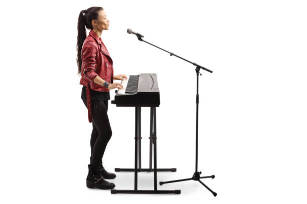 istock Young female artist playing a digital piano 1199050127