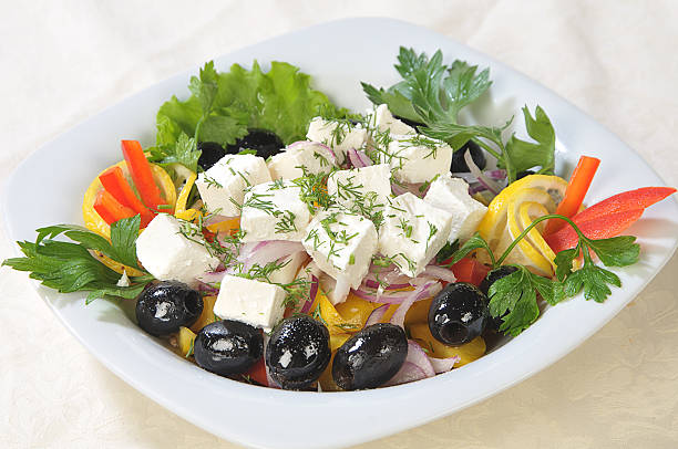 Slices of cheese in a salad stock photo