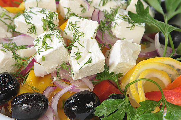 Close-up slices of cheese in a salad stock photo