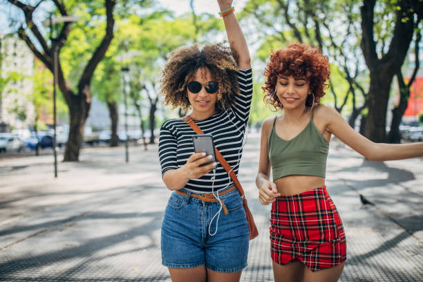 istock Two young women dancing outdoors 1199052199