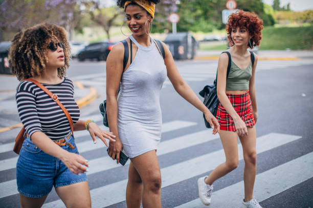 istock Three young women walking outdoors 1199052385