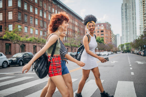 istock Three young women walking outdoors 1199052443