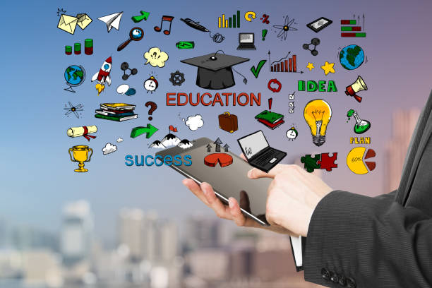 istock Keep educating yourself concept with hand drawn symbols and words and man hands with digital tablet. 1199053235