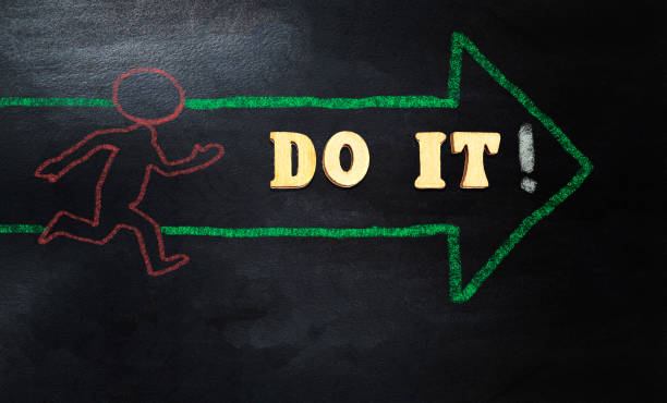 istock forming do it with wooden alphabets, person running with arrow 1199053311