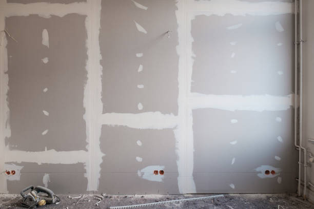 istock drywall background during flat renovation - dry wall room renovation - 1199054312